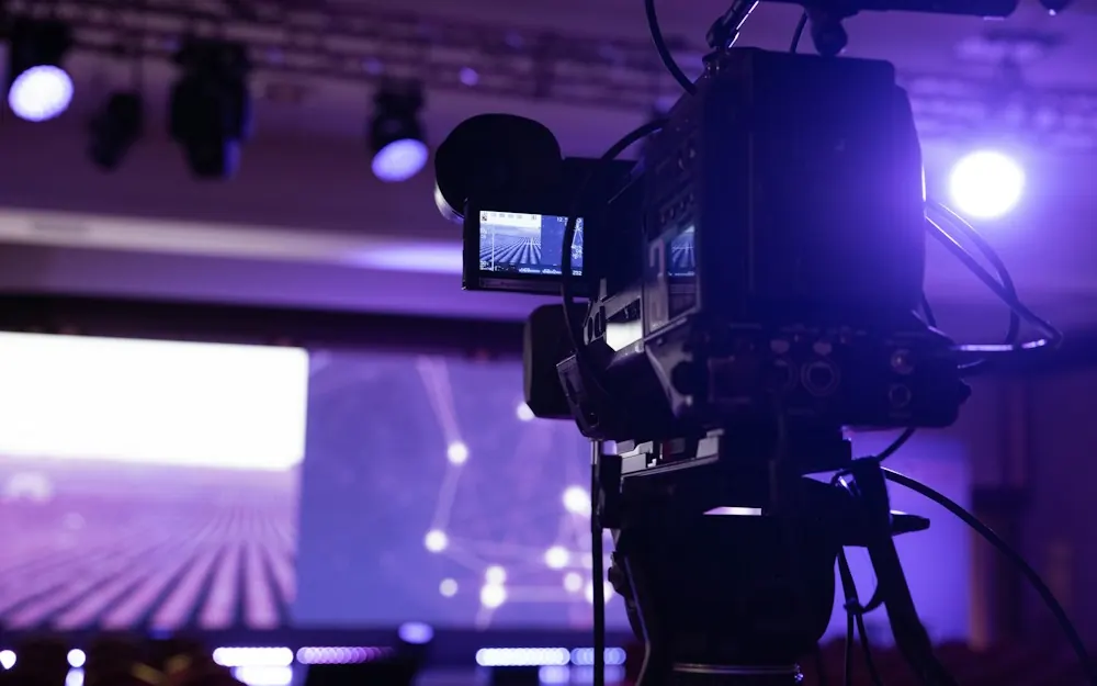 Broadcast camera filming a stage